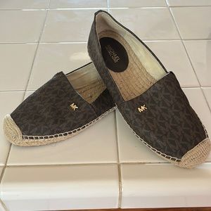 Authentic Micheal Kors slip on shoes. Great condition size 7